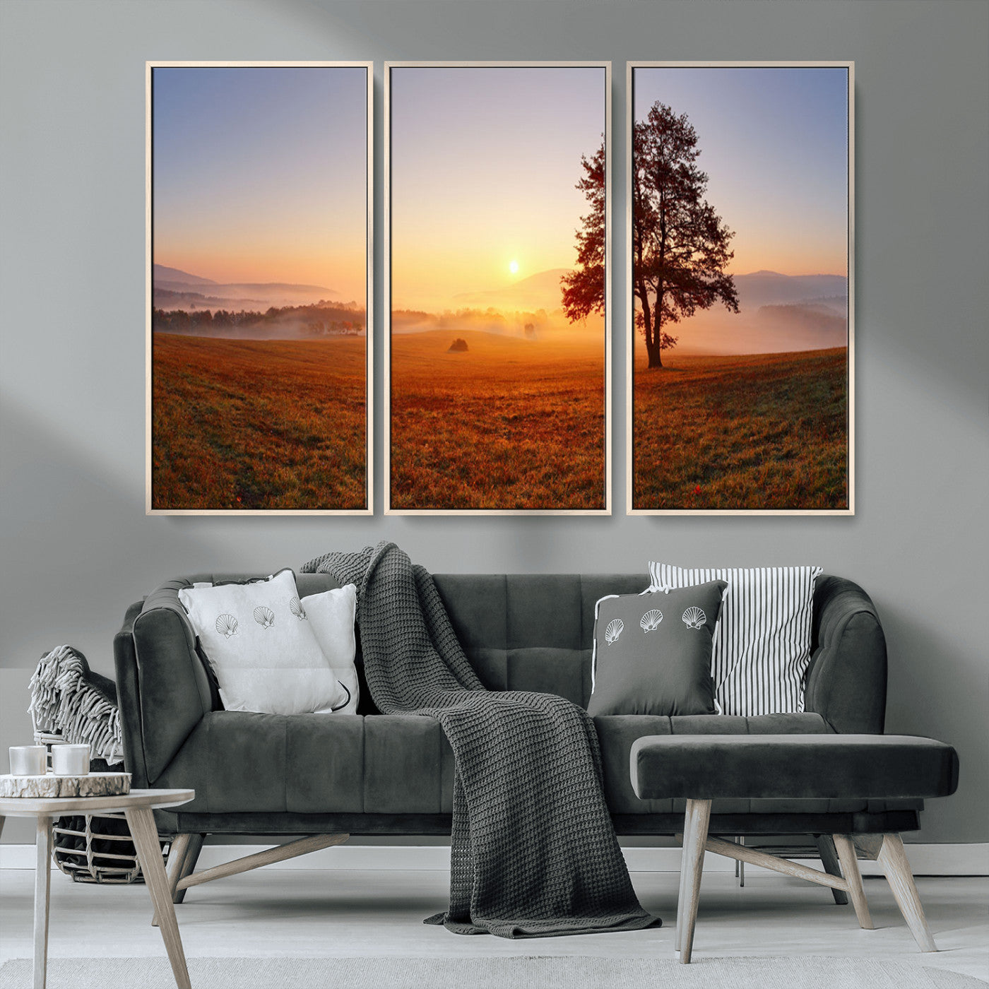 A tranquil landscape at sunrise with a mist-covered field and a lone tree, creating a peaceful and natural atmosphere.