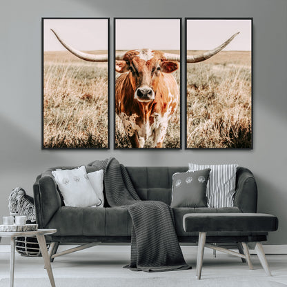 Framed longhorn cow canvas wall art with rustic prairie background, western animal print perfect for farmhouse or ranch style decor