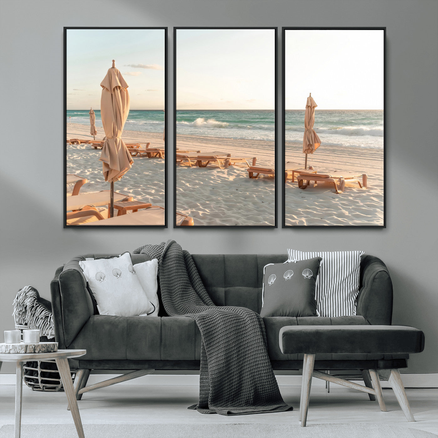 Minimalist photo of empty beach loungers and umbrellas on soft sand, ideal for calm seaside or pastel coastal-style home decor.