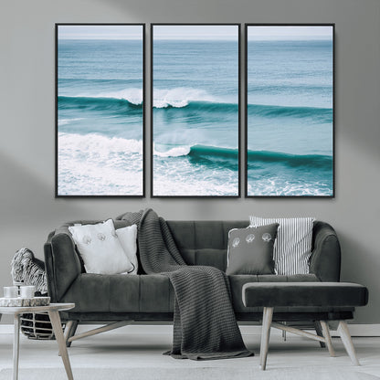 Powerful ocean waves rolling towards the shore, their turquoise hues blending with white sea foam under an open horizon, capturing the essence of the ocean's movement.