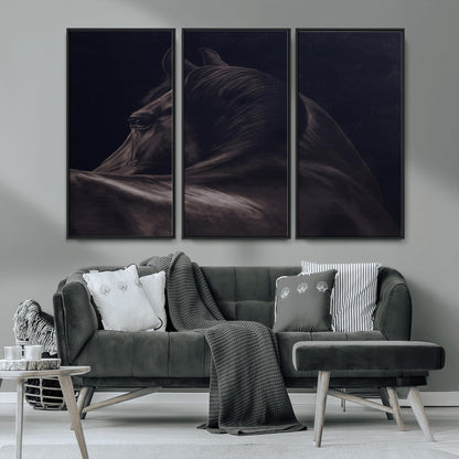 Close-up of a black horse with dramatic lighting on a dark background, perfect for rustic or masculine home decor.