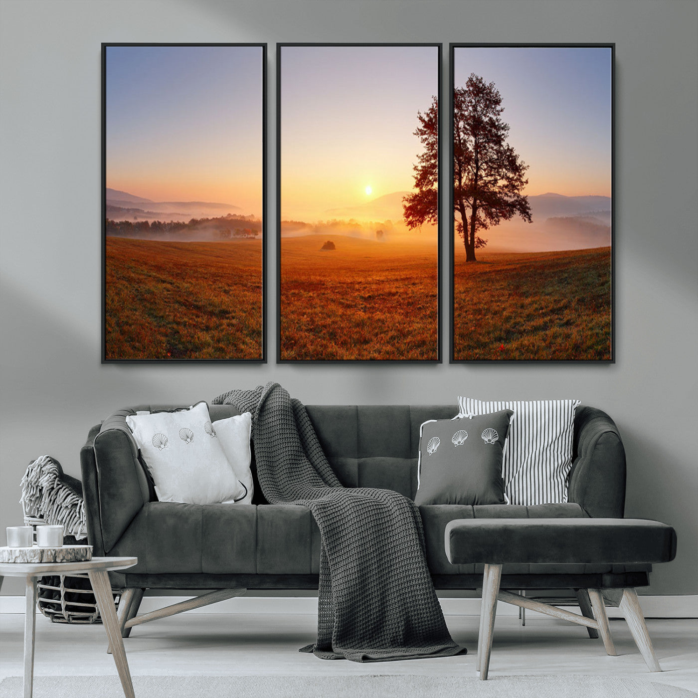 A tranquil landscape at sunrise with a mist-covered field and a lone tree, creating a peaceful and natural atmosphere.