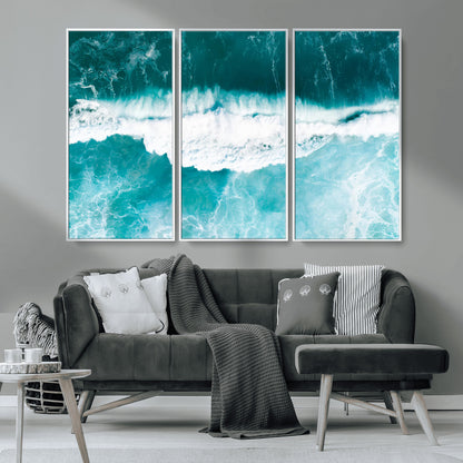 Aerial view of turquoise ocean waves crashing with white foam, perfect for tropical coastal or modern beach-style home decor.