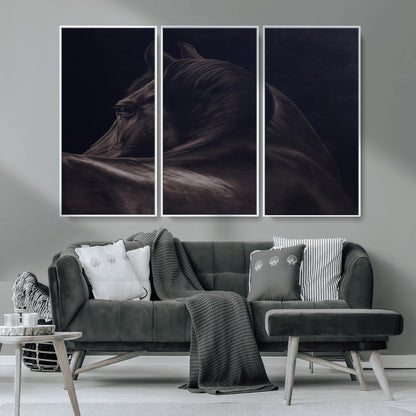 Close-up of a black horse with dramatic lighting on a dark background, perfect for rustic or masculine home decor.