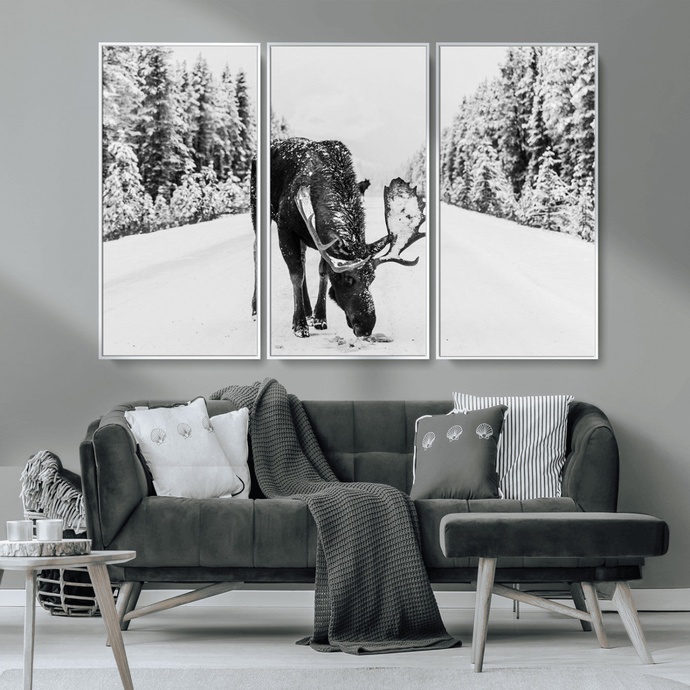 A majestic moose grazing in the snow-covered wilderness, surrounded by snow-covered trees, creating a peaceful winter scene.