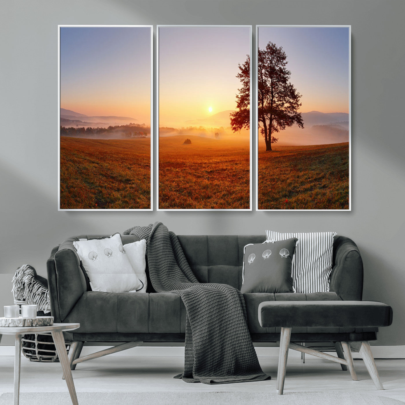 A tranquil landscape at sunrise with a mist-covered field and a lone tree, creating a peaceful and natural atmosphere.
