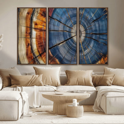 A stunning close-up view of a tree trunk, showcasing the intricate growth rings in a vibrant mix of warm browns, cool blues, and hints of natural texture.