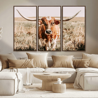 Framed longhorn cow canvas wall art with rustic prairie background, western animal print perfect for farmhouse or ranch style decor