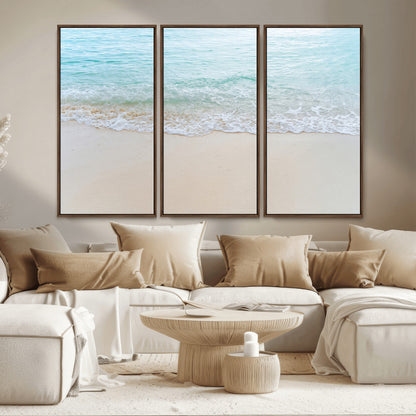 Soft shoreline with gentle aqua waves on smooth sand, ideal for minimalist coastal or pastel ocean-inspired home wall decor.