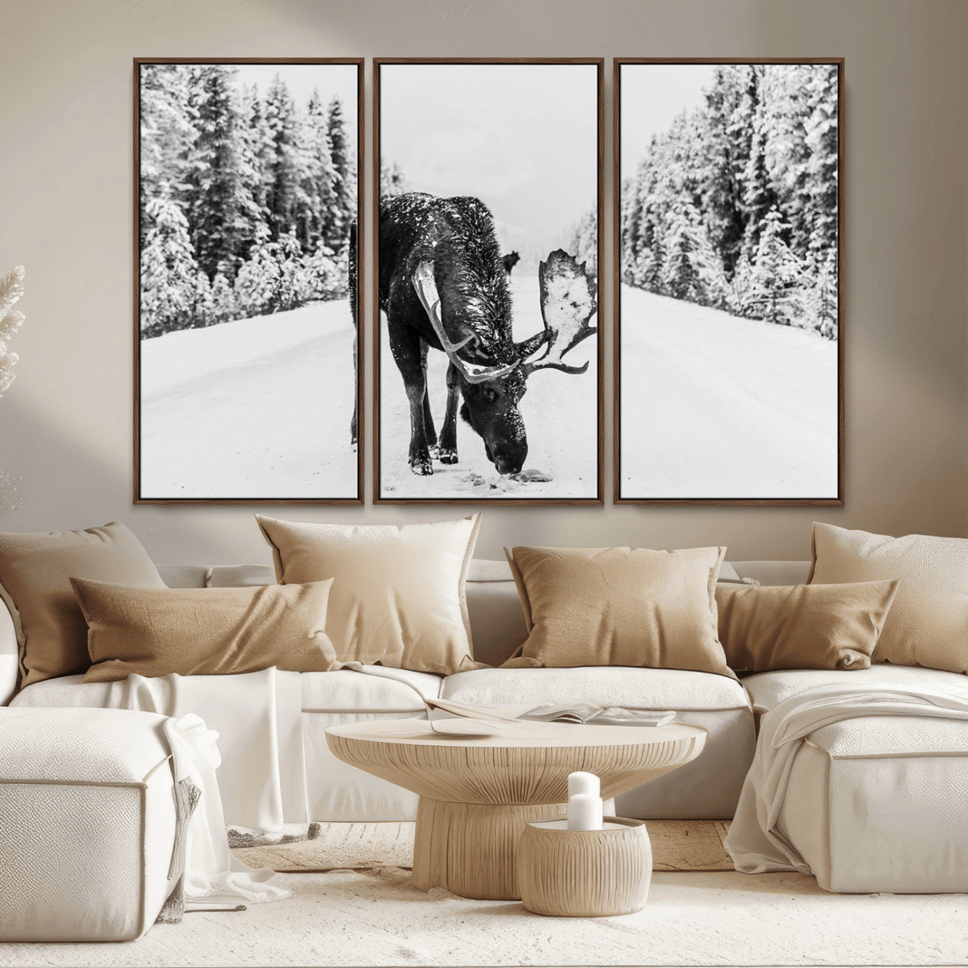 A majestic moose grazing in the snow-covered wilderness, surrounded by snow-covered trees, creating a peaceful winter scene.