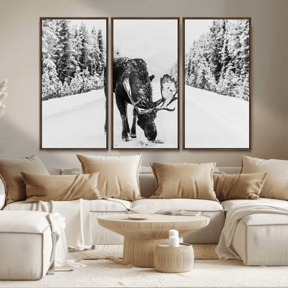 A majestic moose grazing in the snow-covered wilderness, surrounded by snow-covered trees, creating a peaceful winter scene.