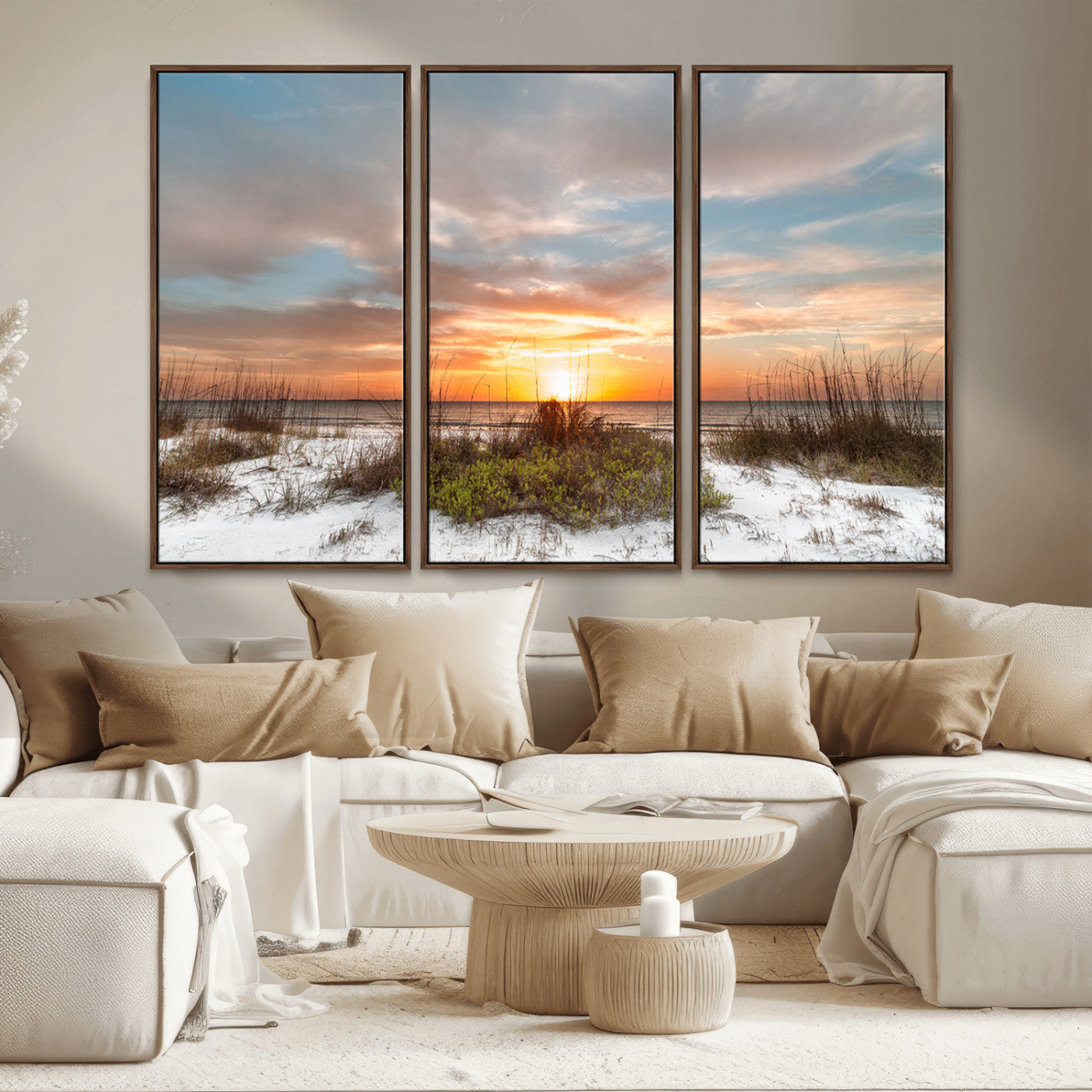 A tranquil beach scene featuring golden sunset hues over the water, with grasses in the foreground and a peaceful, serene atmosphere.
