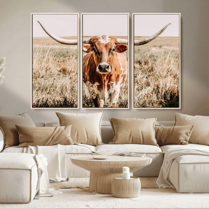 Framed longhorn cow canvas wall art with rustic prairie background, western animal print perfect for farmhouse or ranch style decor