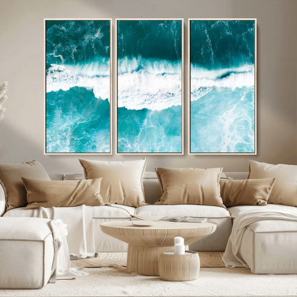 Aerial view of turquoise ocean waves crashing with white foam, perfect for tropical coastal or modern beach-style home decor.
