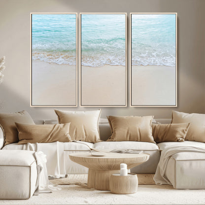 Soft shoreline with gentle aqua waves on smooth sand, ideal for minimalist coastal or pastel ocean-inspired home wall decor.