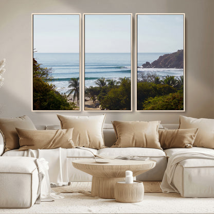 View of calm ocean waves with palm trees and a tropical coastline, ideal for coastal boho or beach-themed wall decor.
