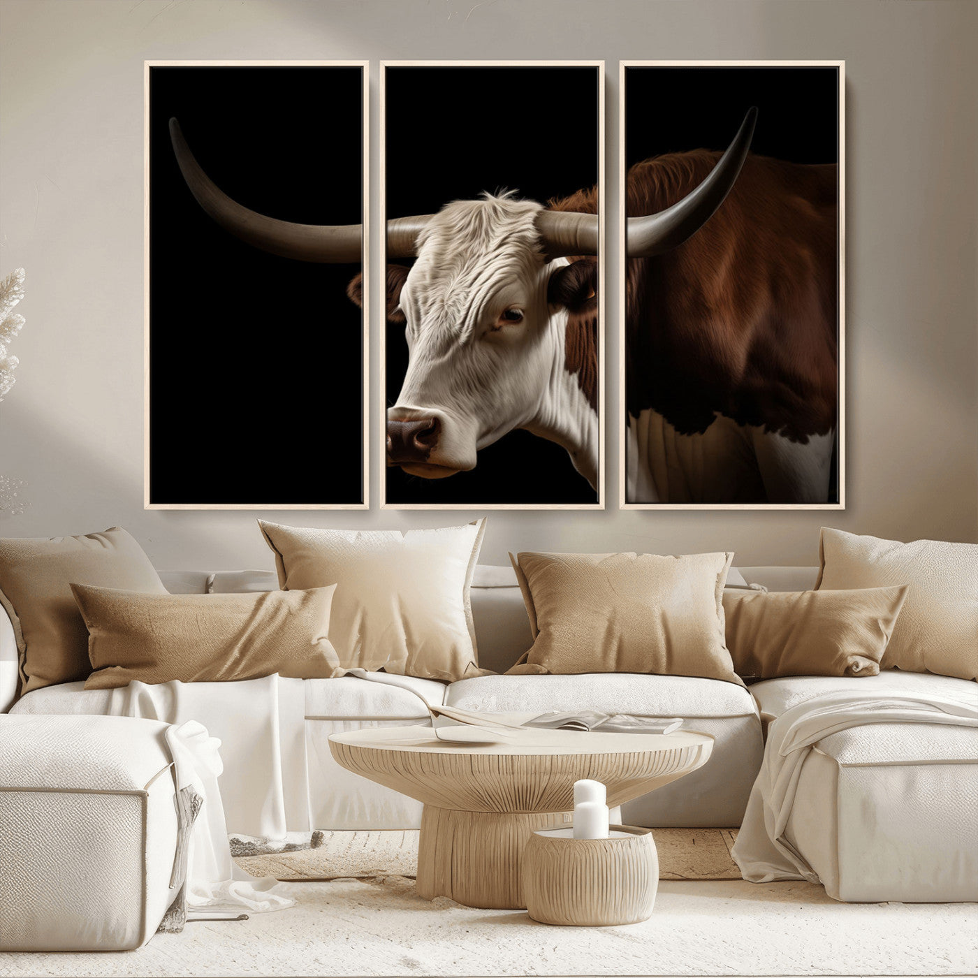 "Close-up of a brown and white longhorn cow with prominent curved horns against a black background."