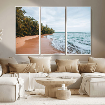 Framed canvas of a tropical beach with palm trees and soft waves, ideal for coastal escape or serene nature-inspired home decor.
