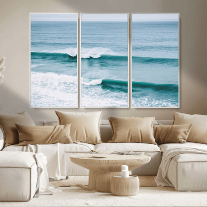 Powerful ocean waves rolling towards the shore, their turquoise hues blending with white sea foam under an open horizon, capturing the essence of the ocean's movement.