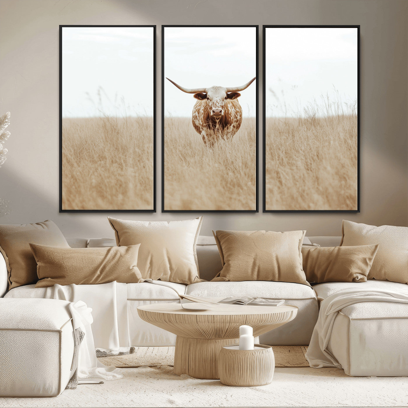 Texas Longhorn bull standing alone in dry grass with neutral tones, ideal for rustic western or cowboy-themed wall decor.