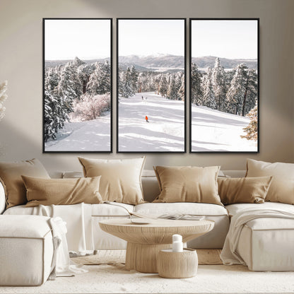Bright ski trail lined with snow-covered pines and a skier in orange, perfect for alpine adventure or winter sports-inspired decor.