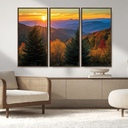 Vibrant sunset over autumn mountains with colorful trees and warm light, ideal for nature lovers or cabin-style wall decor.