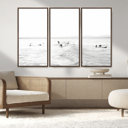 Monochrome photo of surfers riding and waiting on ocean waves, ideal for surf-themed or coastal energy wall decor.
