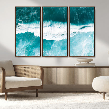 Aerial view of turquoise ocean waves crashing with white foam, perfect for tropical coastal or modern beach-style home decor.
