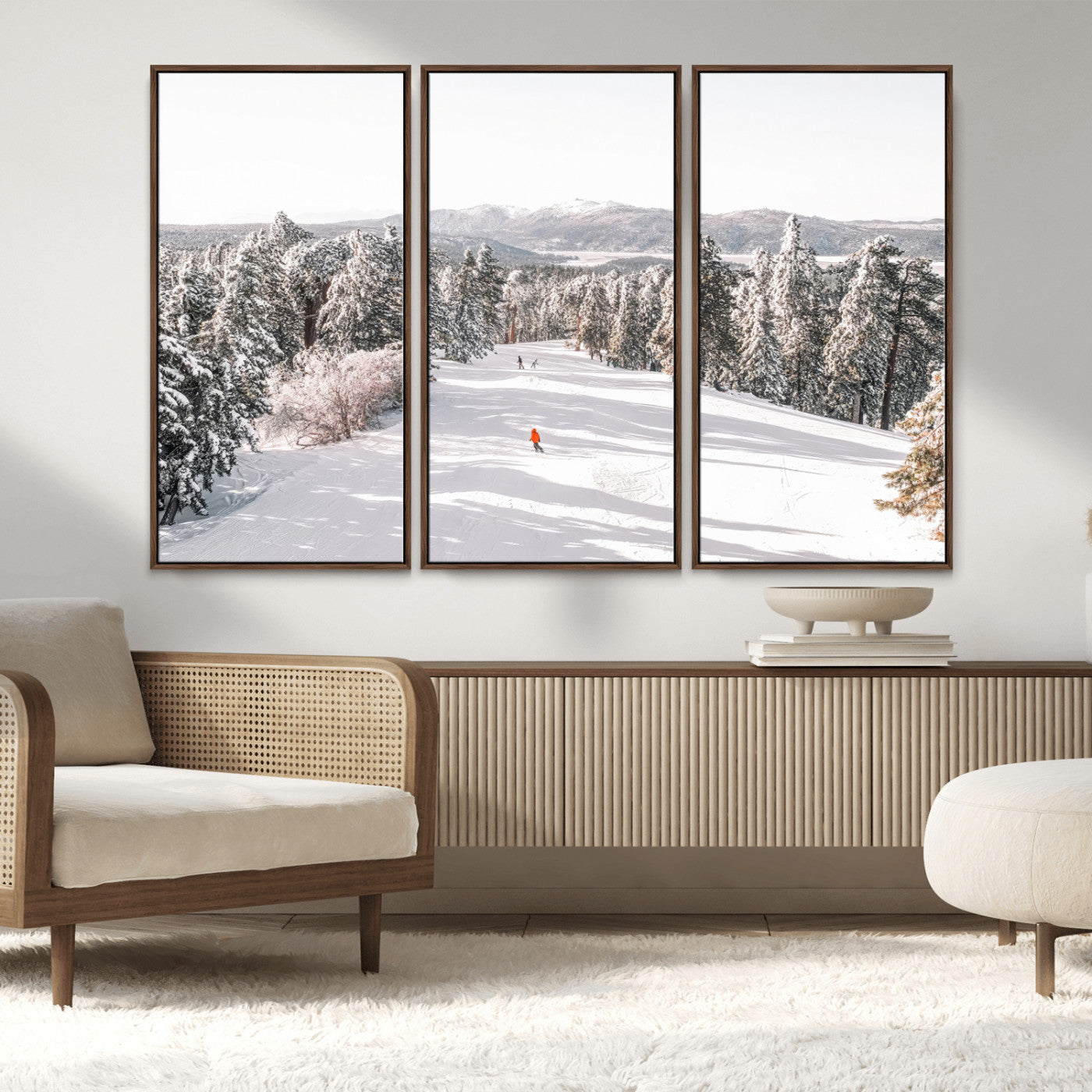Bright ski trail lined with snow-covered pines and a skier in orange, perfect for alpine adventure or winter sports-inspired decor.