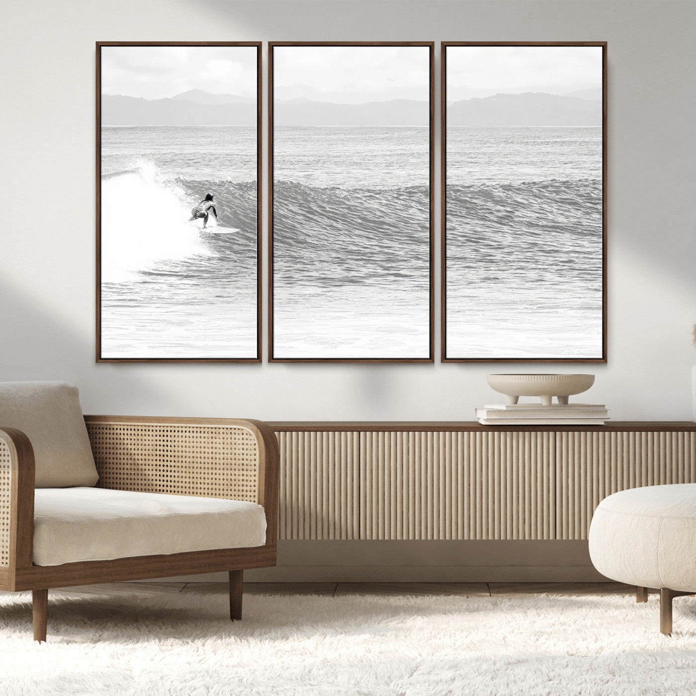 Monochrome photo of a surfer riding a wave with distant mountains, ideal for coastal motion or black and white surf-themed wall decor.