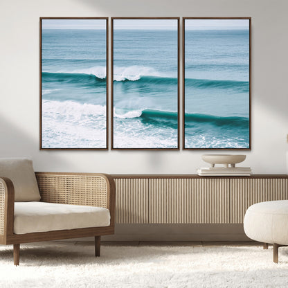 Powerful ocean waves rolling towards the shore, their turquoise hues blending with white sea foam under an open horizon, capturing the essence of the ocean's movement.