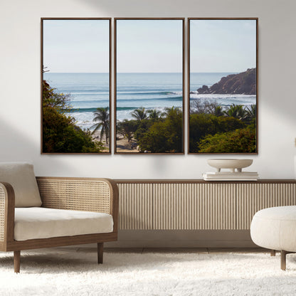 View of calm ocean waves with palm trees and a tropical coastline, ideal for coastal boho or beach-themed wall decor.