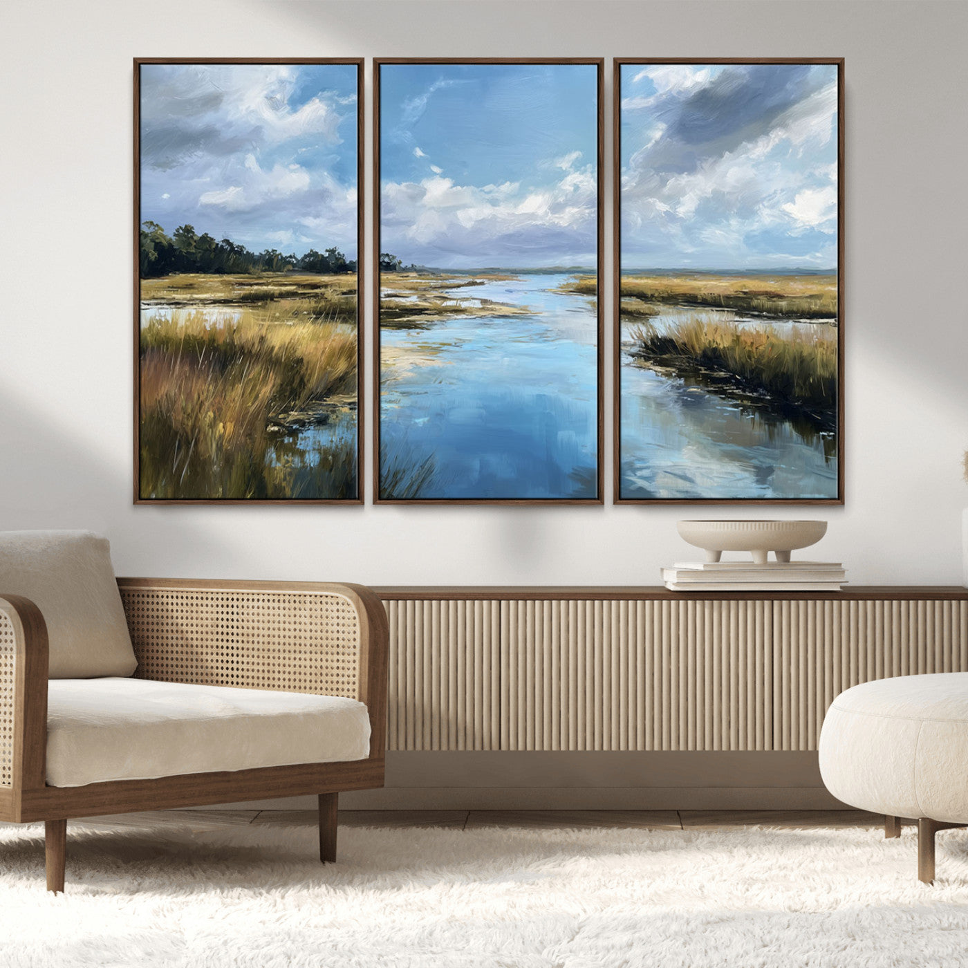 A beautiful, painterly landscape of a calm river winding through a marsh, with vibrant green grasses and a bright blue sky filled with fluffy clouds.