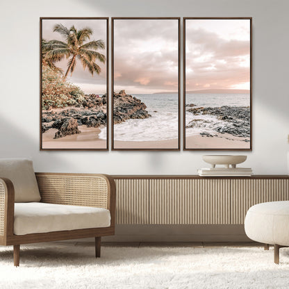 A peaceful beach scene with a palm tree and rocks, soft waves washing onto the shore under a soft pastel sky at sunset.