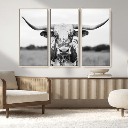 Capture the strength and elegance of nature with this striking black and white portrait of a longhorn cow. Its powerful presence makes a bold statement in any room.