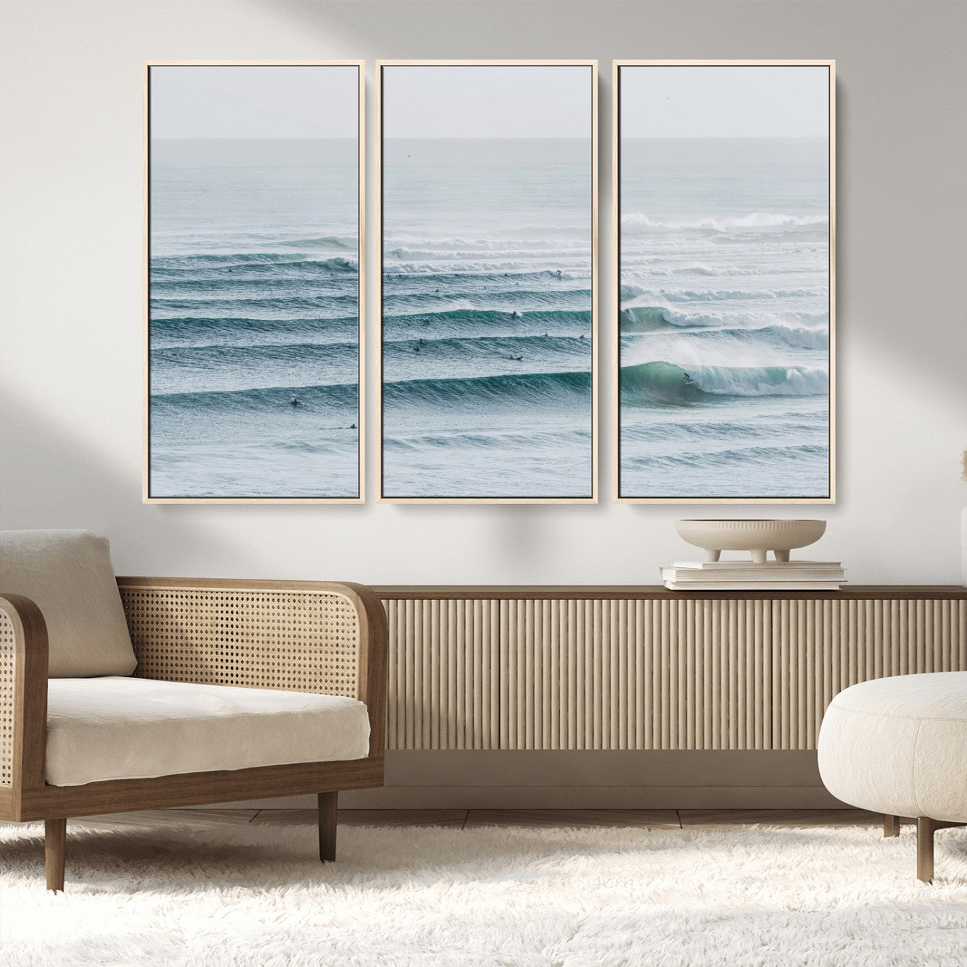 High-angle view of surfers lining up across layered ocean waves, ideal for minimal coastal or surf-inspired room decor.