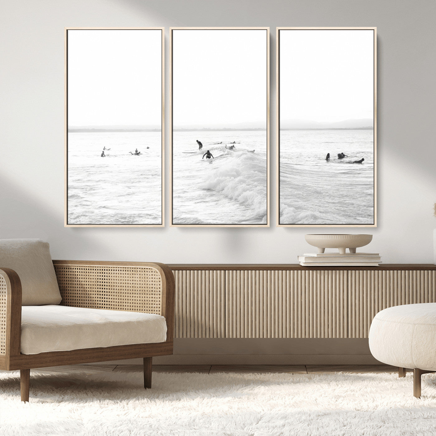 Monochrome photo of surfers riding and waiting on ocean waves, ideal for surf-themed or coastal energy wall decor.