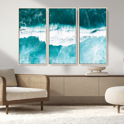 Aerial view of turquoise ocean waves crashing with white foam, perfect for tropical coastal or modern beach-style home decor.