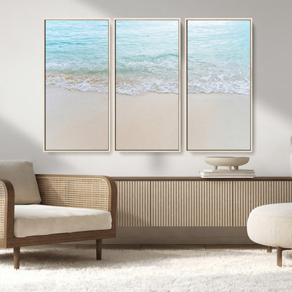 Soft shoreline with gentle aqua waves on smooth sand, ideal for minimalist coastal or pastel ocean-inspired home wall decor.