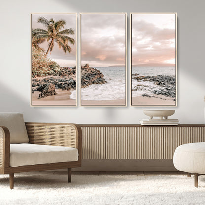 A peaceful beach scene with a palm tree and rocks, soft waves washing onto the shore under a soft pastel sky at sunset.