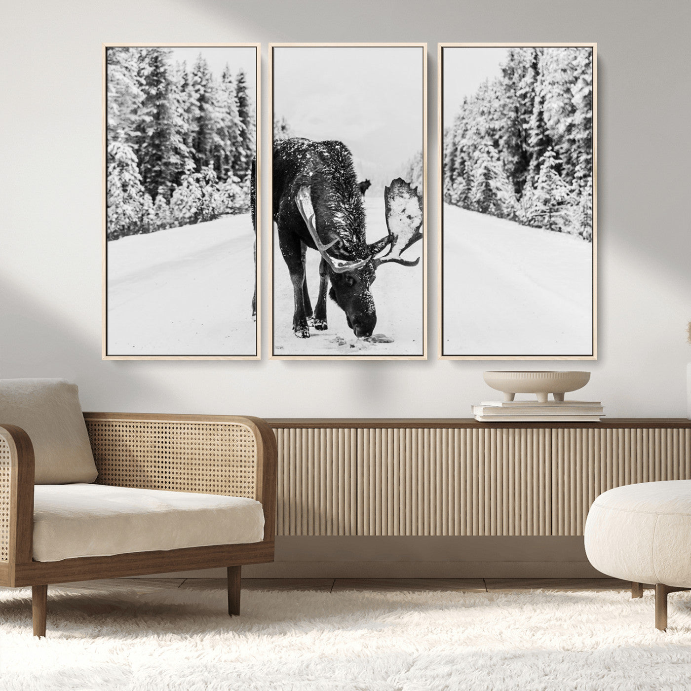A majestic moose grazing in the snow-covered wilderness, surrounded by snow-covered trees, creating a peaceful winter scene.