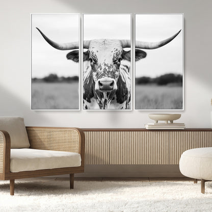 Capture the strength and elegance of nature with this striking black and white portrait of a longhorn cow. Its powerful presence makes a bold statement in any room.