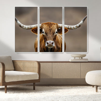 Close-up of a Texas Longhorn with strong curved horns and warm brown tones, perfect for rustic or western-style wall decor.