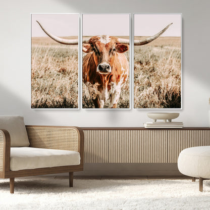 Framed longhorn cow canvas wall art with rustic prairie background, western animal print perfect for farmhouse or ranch style decor