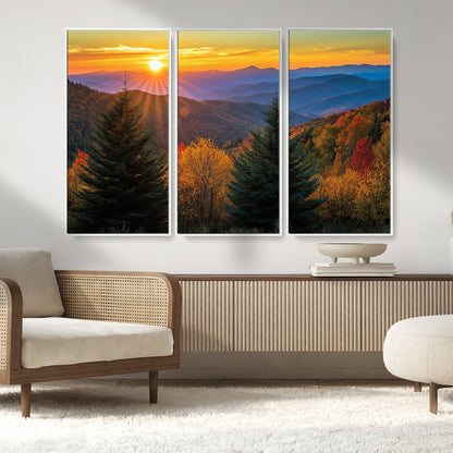 Vibrant sunset over autumn mountains with colorful trees and warm light, ideal for nature lovers or cabin-style wall decor.