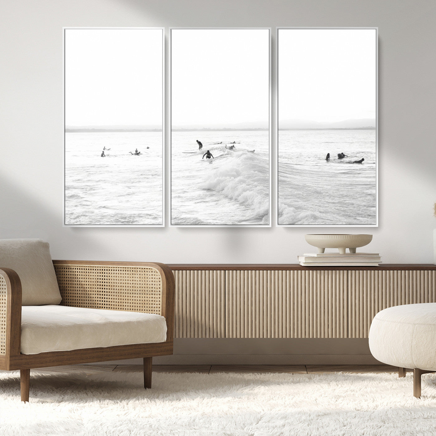 Monochrome photo of surfers riding and waiting on ocean waves, ideal for surf-themed or coastal energy wall decor.