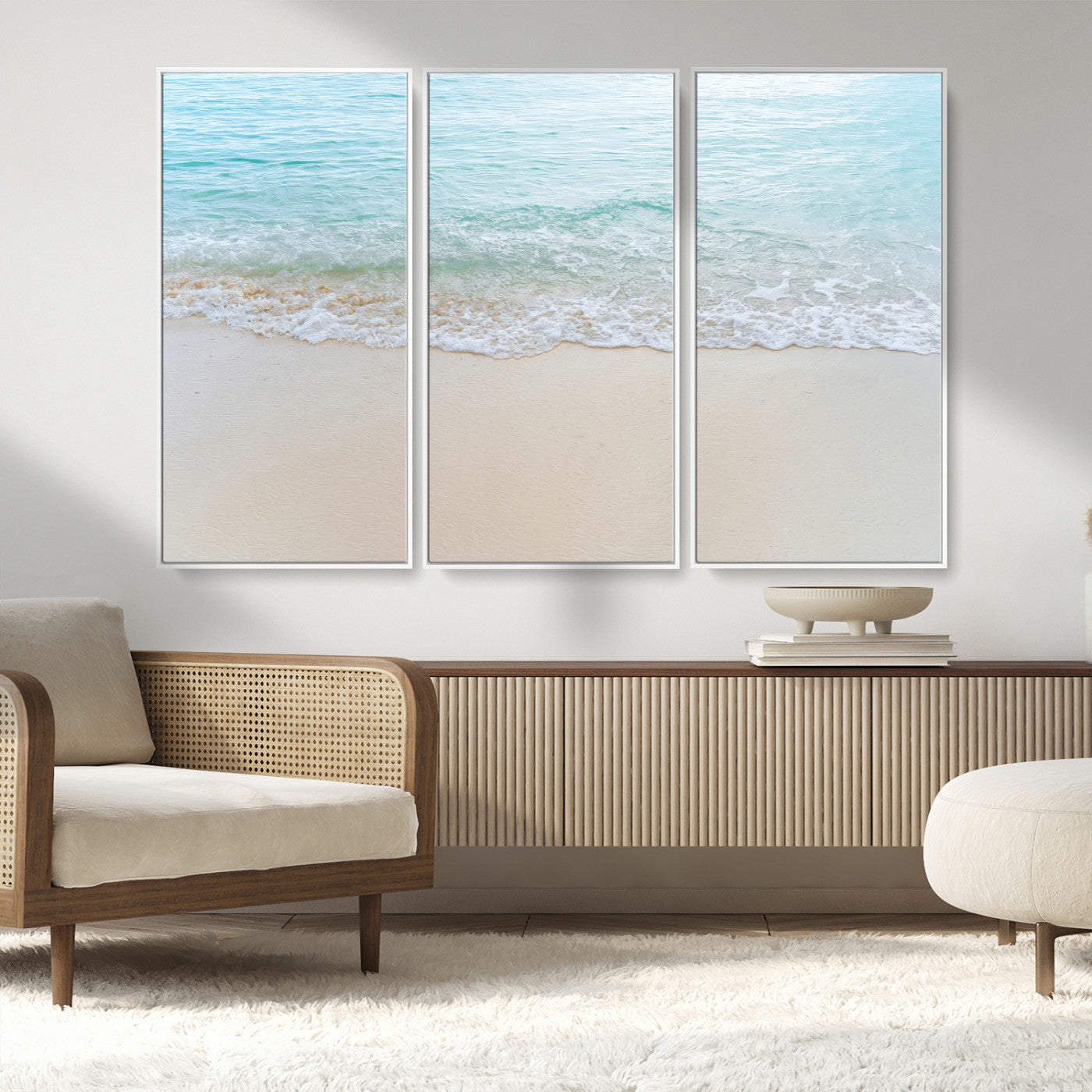 Soft shoreline with gentle aqua waves on smooth sand, ideal for minimalist coastal or pastel ocean-inspired home wall decor.
