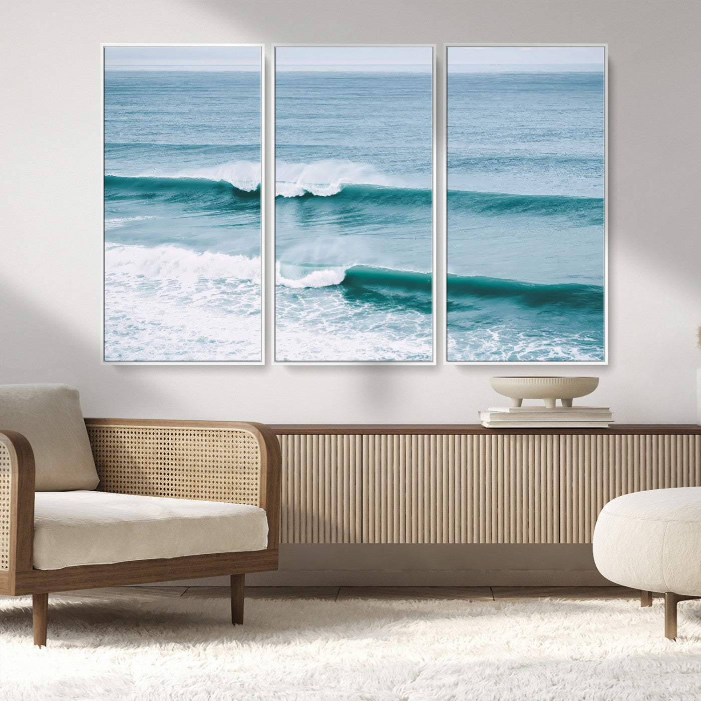 Powerful ocean waves rolling towards the shore, their turquoise hues blending with white sea foam under an open horizon, capturing the essence of the ocean's movement.