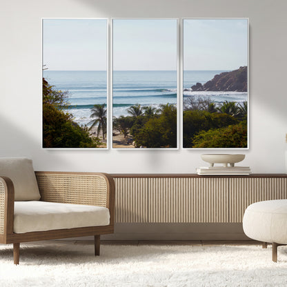 View of calm ocean waves with palm trees and a tropical coastline, ideal for coastal boho or beach-themed wall decor.