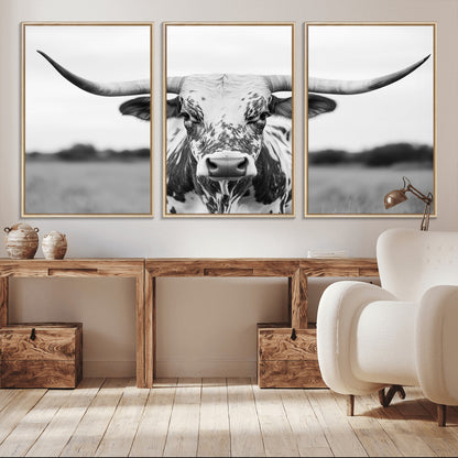 Capture the strength and elegance of nature with this striking black and white portrait of a longhorn cow. Its powerful presence makes a bold statement in any room.